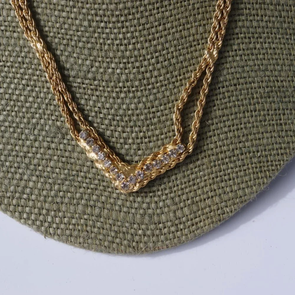 Women`s gold tone crystal double rope necklace.